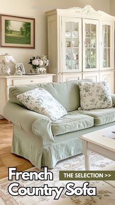 a living room filled with furniture and a white coffee table in front of a china cabinet