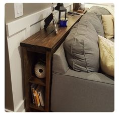 a living room with a couch, table and lamp