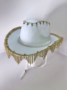 Custom rhinestone strass tassel fringe cowboy / cowgirl felt hat. Choose from Black or White base hat. Next choose Gold, Rose Gold, Silver, Silver AB Teardrop or Silver Teardrop trim. Trim color choice will correspond to rhinestone detail on crown, I.e Gold trim choice will have matching Gold rhinestone detail at the top of hat. A coordinating sequin hatband completes this ultra glam cowboy hat. Perfect for festivals, birthdays, bachelorette, or costume parties..I also offer completely custom or Western High Crown Costume Hat For Rodeo, Western Style Adjustable Hat With Rhinestone Fringe, Adjustable Festival Hats With Rhinestone Fringe, Adjustable Rhinestone Fringe Hat For Festivals, Glam Cowboy, Fringe Cowboy Hat, Cowboy Groom, White Cowboy Hat, Custom Rhinestone