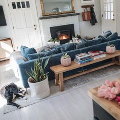 a living room filled with furniture and a fire place