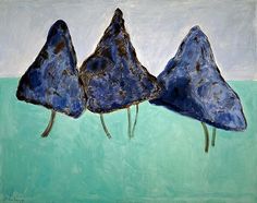 three pieces of blue art work on green and brown paper with trees in the background