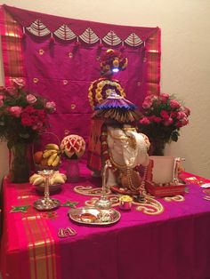 a table topped with lots of different types of food and decor on top of it