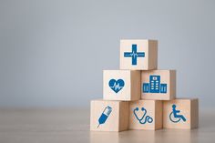 wooden blocks with medical icons on them