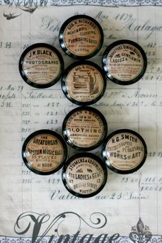 six old fashioned medicine bottles are arranged on a piece of paper