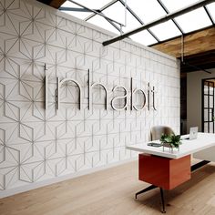 an office with white walls and red desks in front of the sign that reads titan