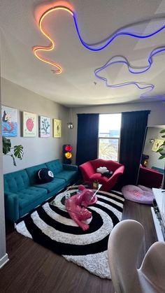 a living room filled with lots of furniture and colorful lights on the ceiling above it