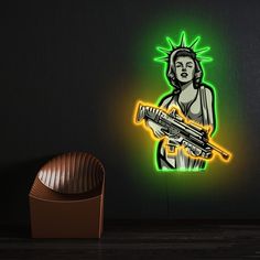 Artwork Statue Of Liberty Neon Sign Introducing the Statue Of Liberty Neon Sign made of LED neon and UV-printed acrylic – the perfect addition to any gamer’s collection! This sign features a sleek design of a female character holding a gun, inspired by the popular video game Grand Theft Auto, all illuminated by vibrant LED [...] Neon Technology, Acrylic Artwork, American Spirit, Grand Theft Auto, Popular Videos, Led Neon, Visual Merchandising