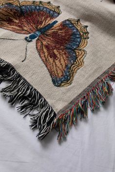 This woven throw blanket features a collection of boho-inspired butterflies decorated allover. It's broad spectrum of pastel colors intricately woven together makes a statement in any room. Trimmed with multicolor fringed edges. Content + Care- 100% Cotton- Machine Wash, Cold Cycle, Mild Detergent, Do Not Bleach; Tumble Dry Low Heat- Made in the USA Size- Dimensions: 37”W x 52”L- Dimensions: 50”W x 60”L- Dimensions: 60”W x 80”L Boho Butterfly, Woven Throw Blanket, Woven Throw, Pastel Colors, Bohemian Rug, Throw Blanket, Room Decor, Quick Saves, Color