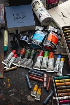 the contents of an artist's supplies including paint, pencils and markers