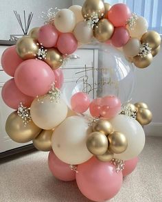 a wreath made out of balloons on the floor