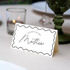 a place card sitting on top of a table