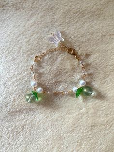 Handmade Jewelry! Green-leafed fruit charmed bracelet.  ~ All jewelry is made to order!! Please be patient and confirm that you've correctly selected your desired size. ~ Everything measured in centimeters || All jewelry comes with a 5-6 cm extension chain. Remember that although this piece is made with care, it is still fragile. Please follow these suggestions.   (o･ω･o)→  Avoid contact with water or moisture: exposure to moisture can affect the quality and lifespan of the pieces.  (o･ω･o)→ Avo Trendy Green Jewelry With Fruit Design, Charmed Bracelet, Fruit Bracelet, Bracelet Gold, Charm Bracelets, Beauty Book, Jewelry Bracelets, Gold Bracelet, Handmade Jewelry