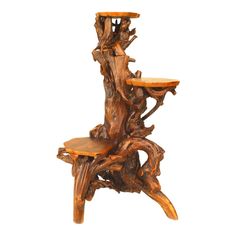 a chair made out of tree branches with a wooden seat