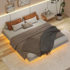 a large bed sitting on top of a wooden floor