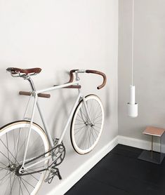 a bicycle mounted to the side of a wall