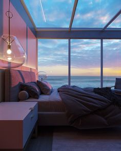 a bedroom with a large window overlooking the ocean