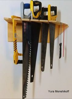 there are many different tools hanging on the wall