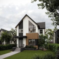 two story white and black house with trees in the front yard on a cloudy day