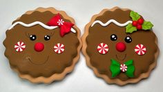 two decorated cookies sitting on top of each other