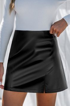 Channel your inner rock star with the Black Faux Leather Notched Hem Mini Skirt. The edgy faux leather and notched hem give you a rebellious vibe while keeping it chic. Product code: CAA02B4J008AA Features:  Woven Notched hem Mini Wash Method: Hand Wash Lining: 100%POLYESTER Material: 50%POLYURETHANE,50%POLYESTER. Solid Color Faux Leather Mini Skirt, Rock Style Mini Skirt For Fall Night Out, Rock Style Mini Skirt For Night Out In Fall, Fall Rock Style Mini Skirt For Night Out, Faux Leather Mini Skirt For Party, Fall Faux Leather Mini Skirt, Rock Style Fall Skirt, Fitted Faux Leather Pleated Skirt, Fitted Faux Leather Mini Skirt, Edgy Style