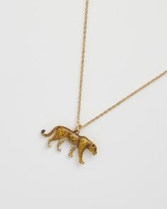 Embrace the wild elegance of our Leopard Pendant Necklace. This hand-painted enamel charm on a delicate chain symbolises power and grace. Ideal for adding a touch of the exotic to your attire, it channels the leopard’s fierce independence and sophistication, perfect for your cultural explorations.


Key features:


Pendant: 18ct High polish gold plated brass, zinc alloy, enamel 
Chain: 18ct High polish gold plated brass



41cm (16"") Chain with 5cm (2"") extender; Pendant: 17mm height x 24mm wi Leopard Necklace, Animal Bracelet, Luxury Christmas Gifts, Talisman Necklace, Gold Plated Bangles, The Leopard, Animal Brooch, Delicate Chain, Enamel Charms