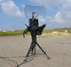 a satellite dish sitting on top of a tripod