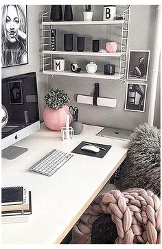 a white desk topped with a computer monitor and keyboard