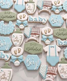 baby shower cookies are arranged on a table