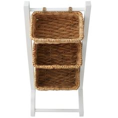 three wicker baskets on a white shelf