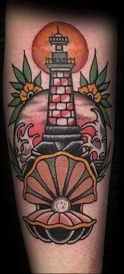 a tattoo with a lighthouse on it