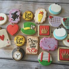 many decorated cookies are arranged on a table