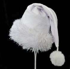 "White as snow and classic Santa styling in velvety soft minky polyester fabric slouch style stocking Santa hat. There is a soft and fluffy white faux fur fabric turn up brim for the trim and a white faux fur pompom dangle.  Proportions of the hat are generous and will fit most head sizes, ladies or gents.  Measurement for opening for your head is 24-25\" circumference and the length is 20\". Check measurements to make sure this size will work for you.   Custom orders for larger and smaller head White Mini Hats For Winter Party, 30th Outfit, Santa Claus Costume, 30 Outfits, Christmas Clothes, Cowboy Christmas, Fur Fabric, Christmas Celebration, White Caps