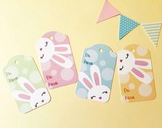 four tags with bunny ears and bunnies on them