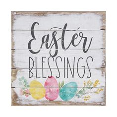 a wooden sign that says, easter blessings with painted eggs and flowers on it