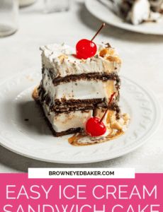 a piece of ice cream sandwich cake on a white plate with a cherry in the middle