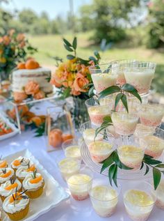 there are many cupcakes and desserts on the table