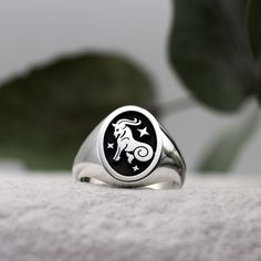 *IMPORTANT ANNOUNCEMENT - PLEASE READ BEFORE PURCHASE* We are currently on our Christmas holidays! Our shop is totally still open for business and we are taking your orders, however we won't be shipping your order out until around the 20th of January 2025. Thanks for understanding and have a great Christmas and New Year!  This Zodiac signet ring features a sea-goat on a black background with three twinkling stars. Birthdates - 22nd December - 20th January Element - Earth Capricorn is the tenth s Zodiac Jewellery, Sea Goat, Burning Rose, Oval Signet Ring, Rose Jewellery, Astrology Jewelry, Element Earth, Twinkling Stars, A Goat