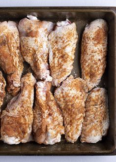 several pieces of chicken in a baking pan