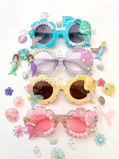 several pairs of sunglasses with different designs on them