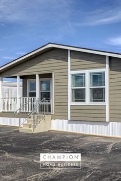 a mobile home with the words champion written on it's front door and stairs