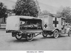 an old ambulance being pulled by a horse and carriage