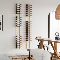 a dining room table and chairs with wine racks on the wall