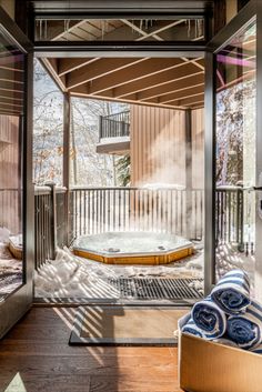 a hot tub sitting inside of a wooden enclosure