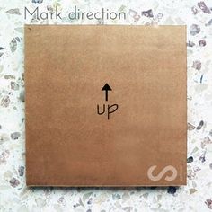 a brown box with an up arrow drawn on it