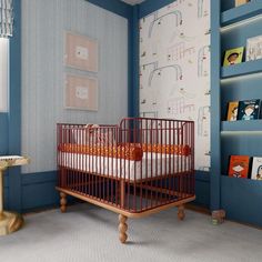 a baby's room with a crib and bookshelf