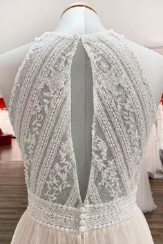 the back of a wedding dress on display at a bridal shop in london, england