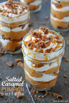 three desserts in small glass jars with toppings on the top one is topped with whipped cream and caramel