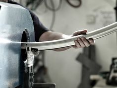 a man working on a machine in a shop