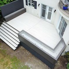 an aerial view of a house with steps leading up to the front door and patio