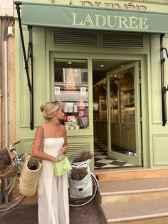 a woman standing in front of a store